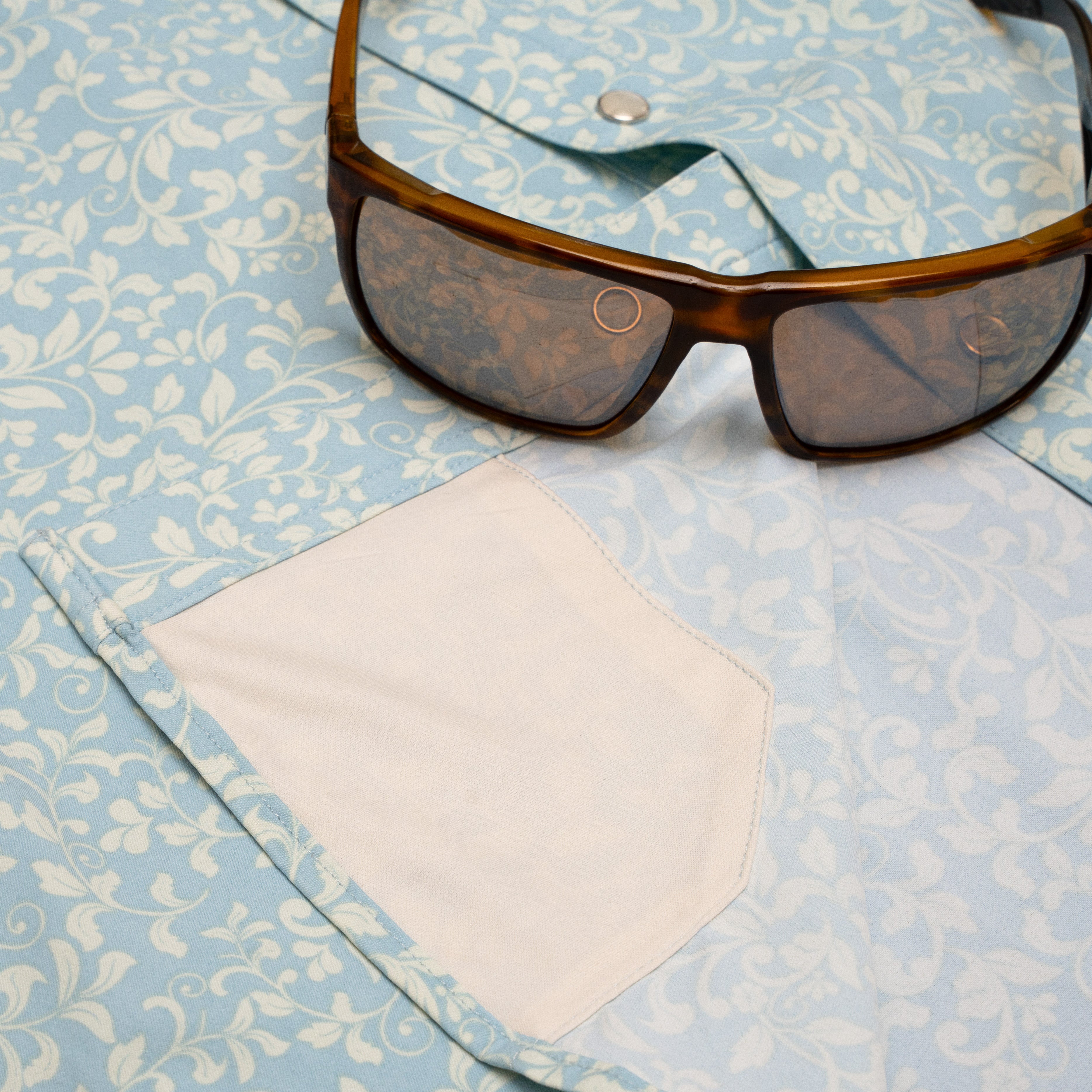 sunglasses on pearl snap shirt with fabric cleaner