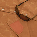 Sunglass cleaner hidden fabric on orange denim western shirt