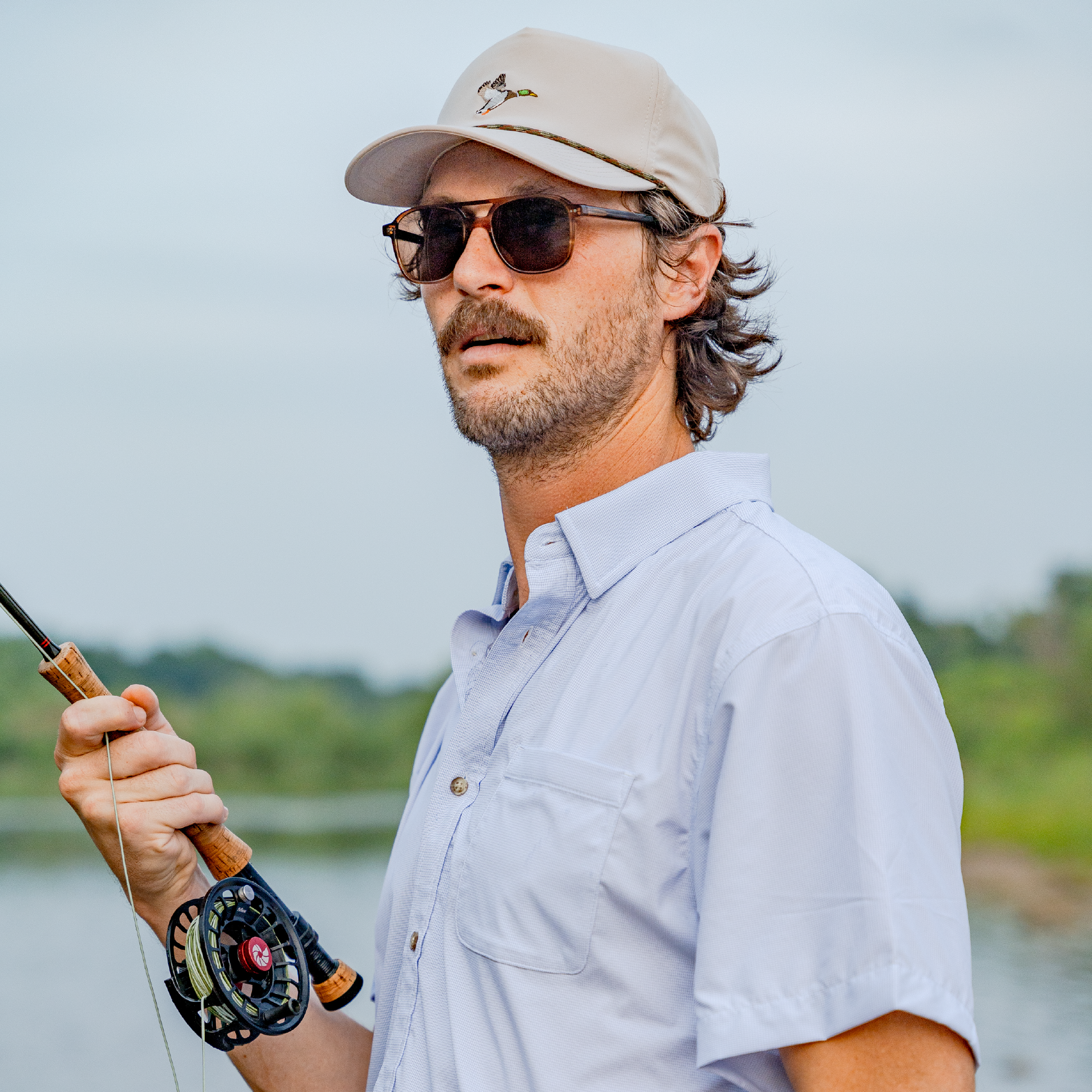 man fishing in blue micro short sleeve