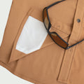 sunglass cleaner on brown shirt