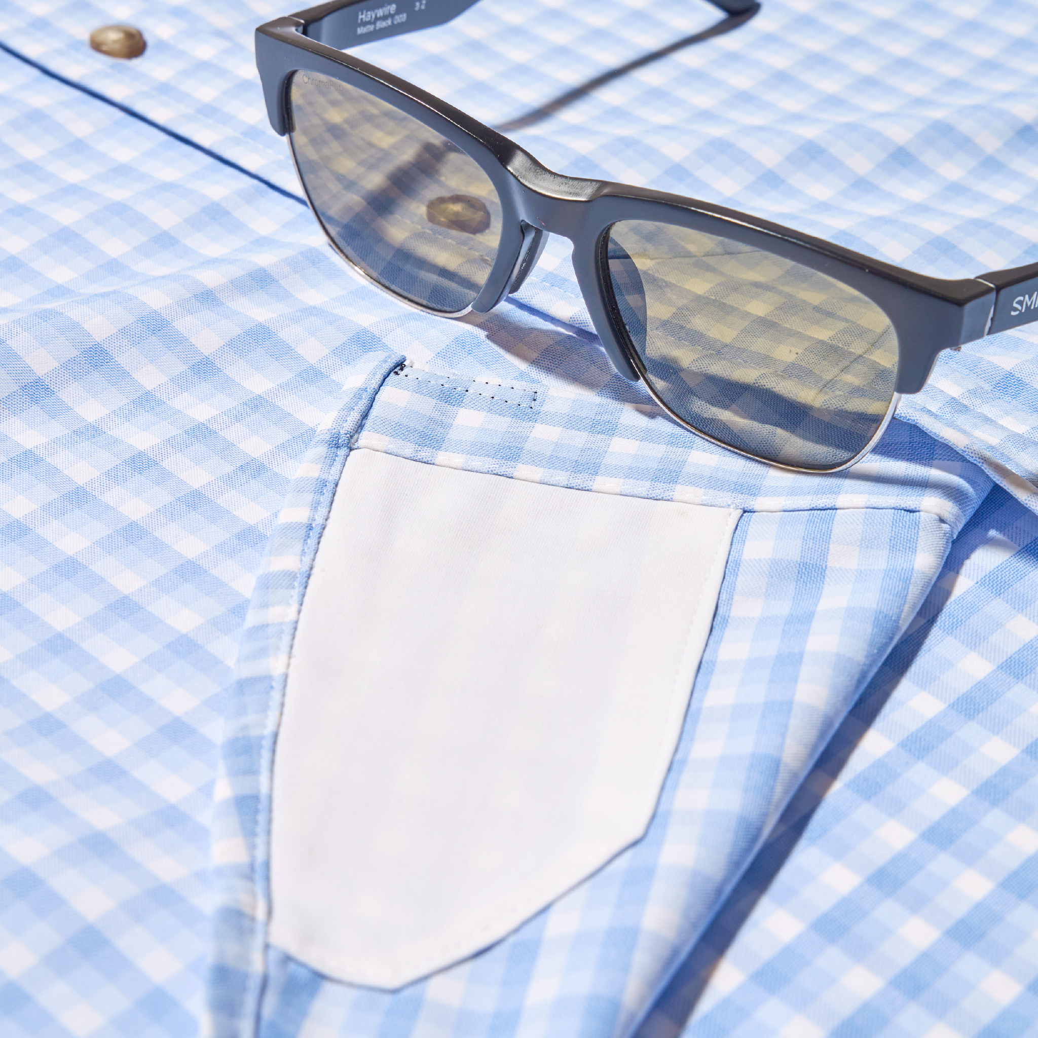 sunglass cloth on blue plaid long sleeve