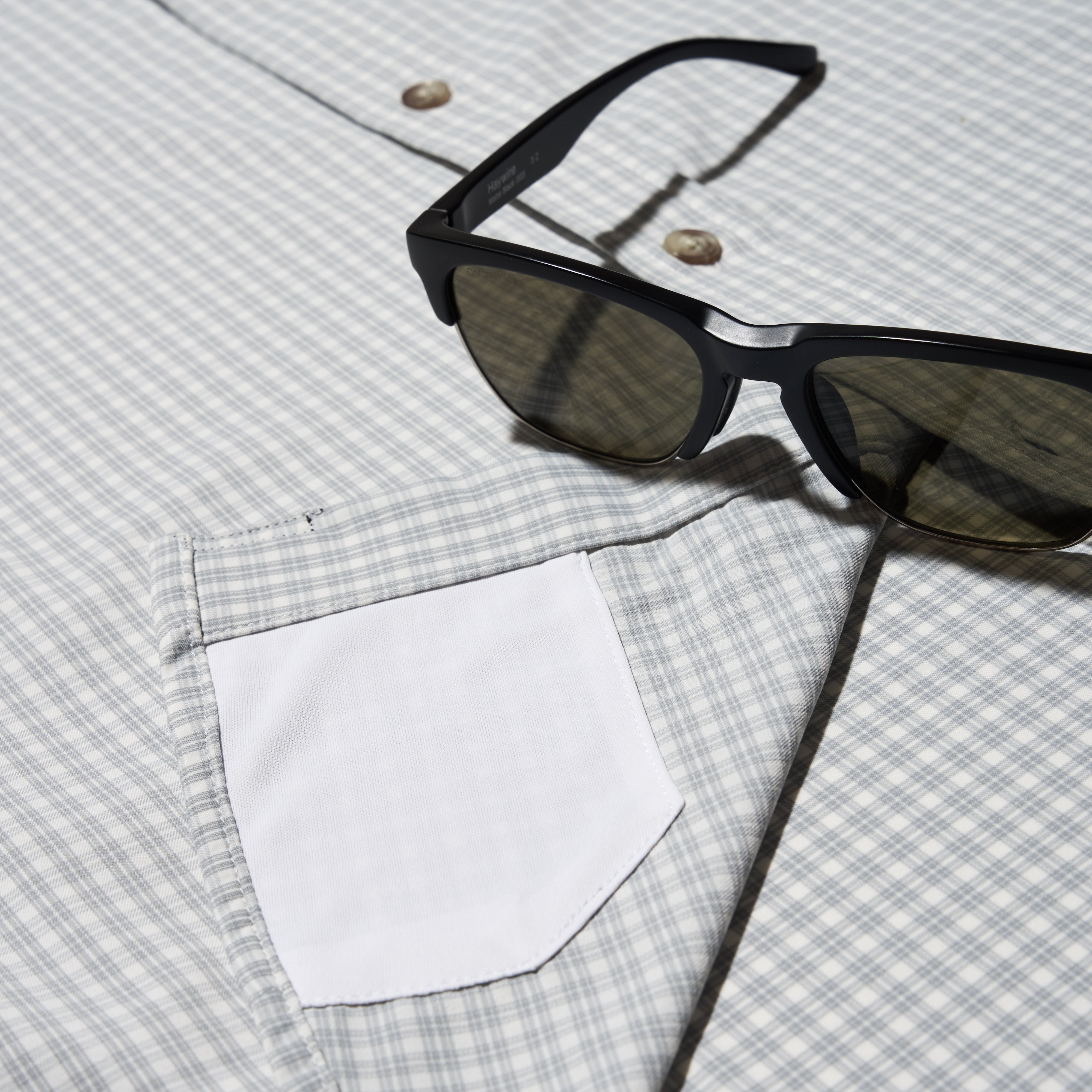 close up photos of grey button up sunglass cleaner