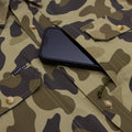 phone in chest pocket of camo shirt