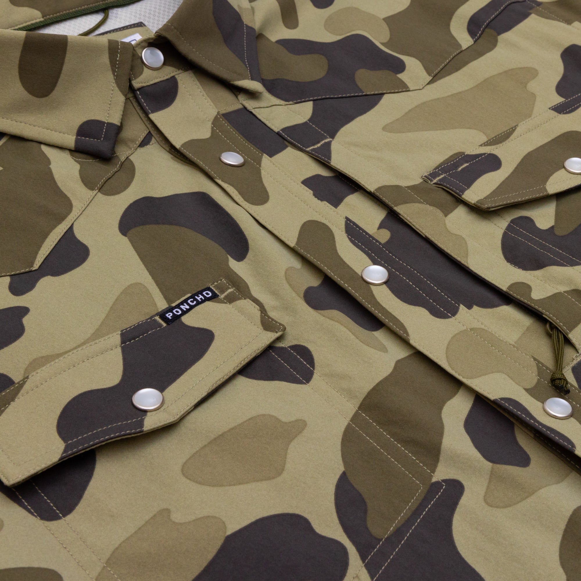 Close up of camo shirt with pearl snaps