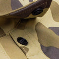 Close up of snap collar on camo shirt