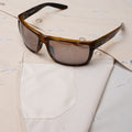 Hidden sunglass cleaner fabric on seagull pearl snap