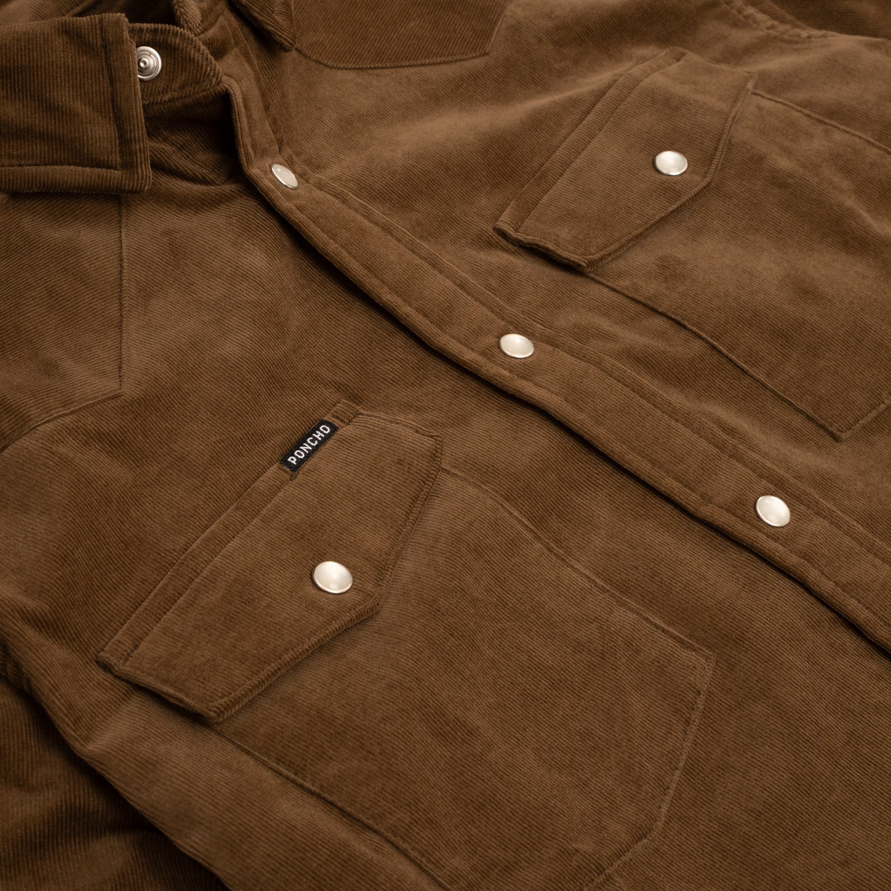 Close up product photo of brown western corduroy shirt