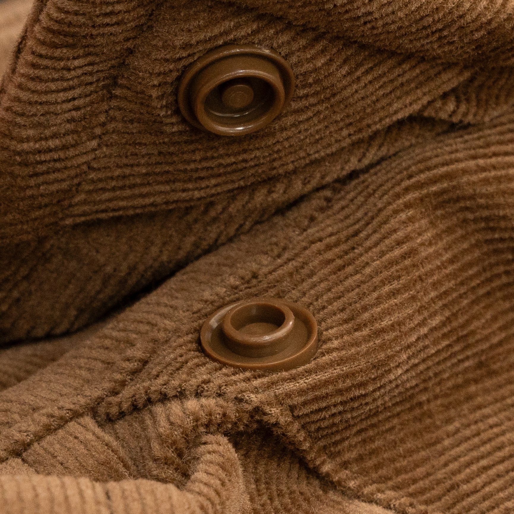 Close up of hidden collar snap buttons