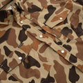 Product photo of chest pocket on camo flannel