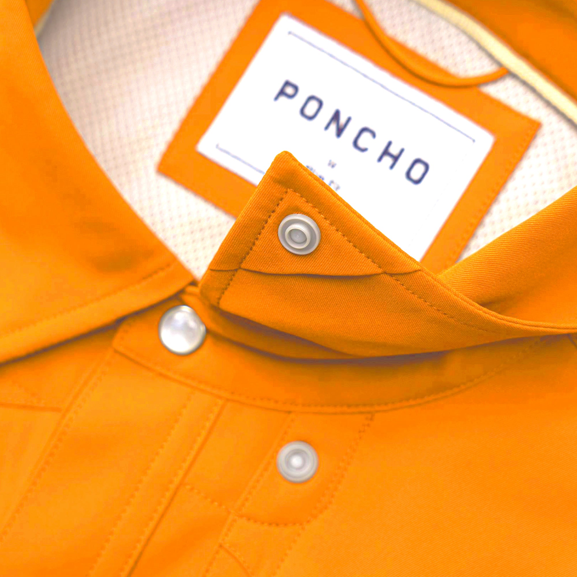 Snap collar on button down orange shirt.