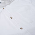 close up photo of white button up with one chest pocket