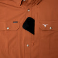 phone in chest pocket of texas longhorn shirt