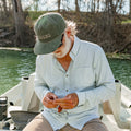 man wearing green micro grid shirt