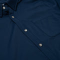 Close up photo of navy button down shirt with one pocket