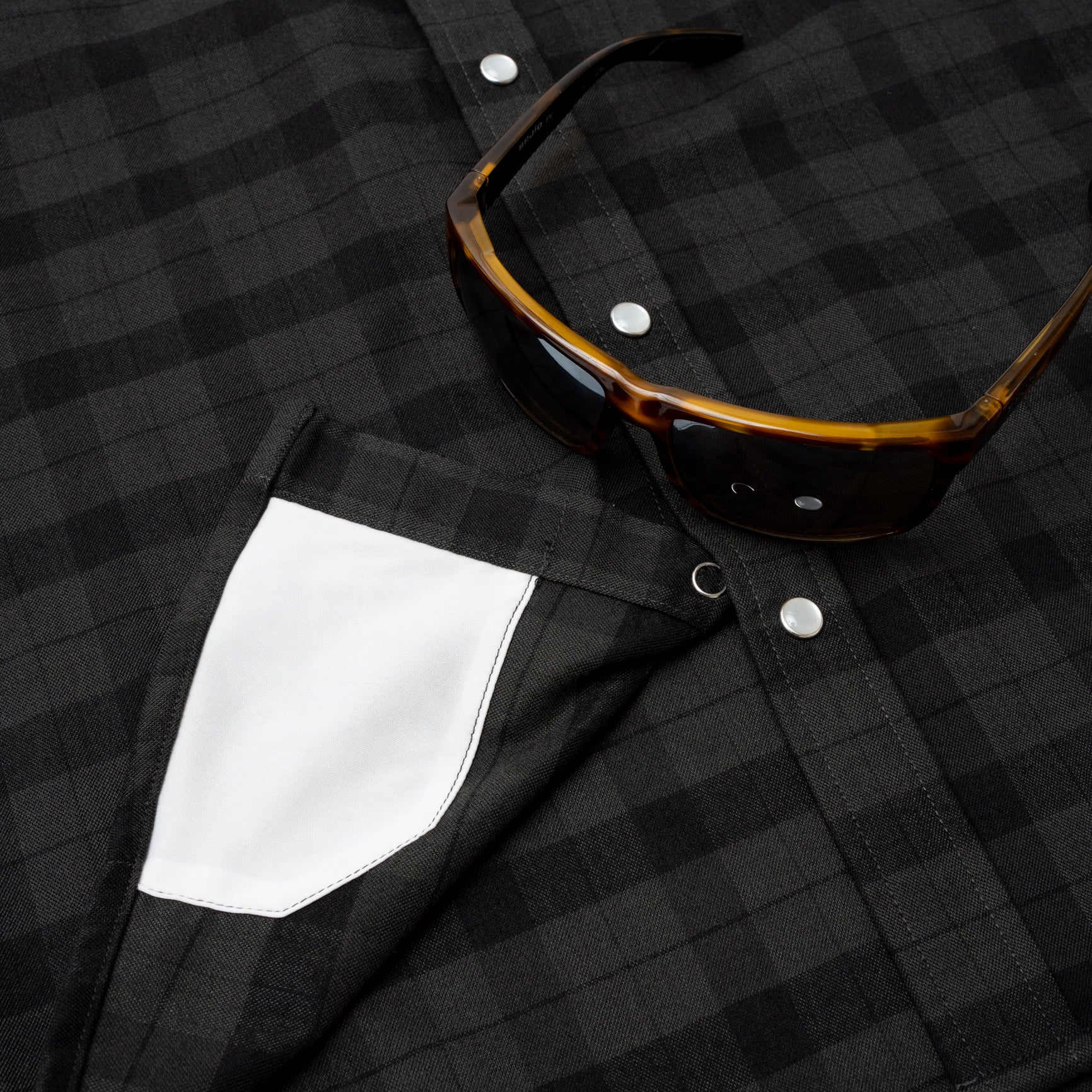 sunglass cleaner fabric on inside of pearl snap black plaid flannel