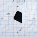 Phone in pocket of button down short sleeve blue plaid shirt