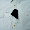 phone in chest pocket of micro grid fishing shirt