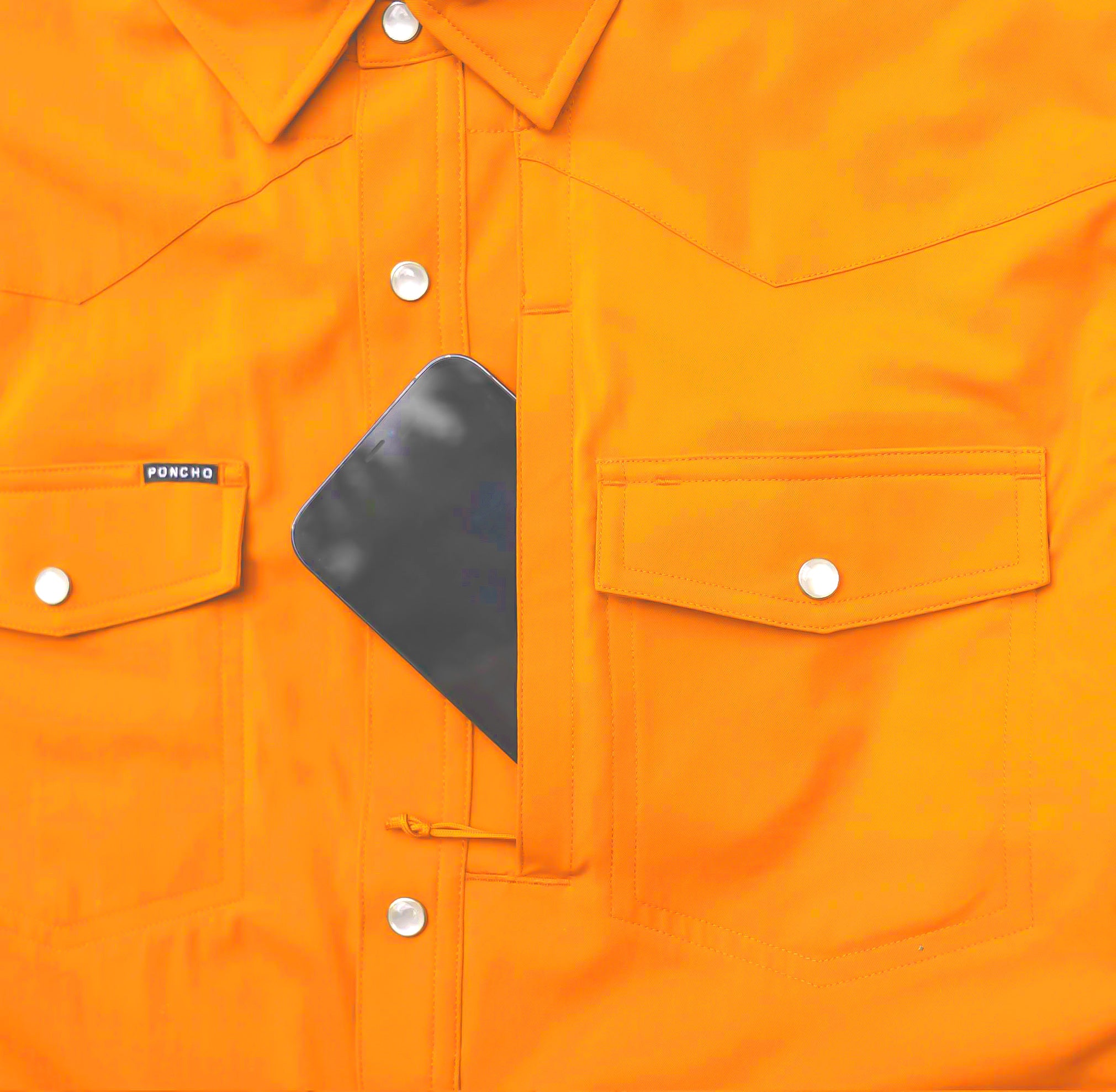 close up of phone in pocket on orange button down shirt